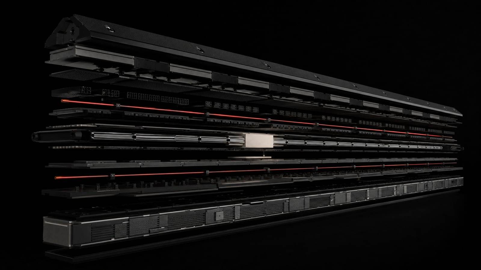 Exploded cutaway of a layered operational spine with a signal line passing through each layer.